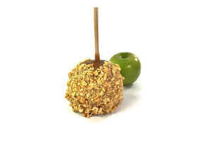This is a caraeml apple with peanuts.  There is also Granny Smith apple in the background.